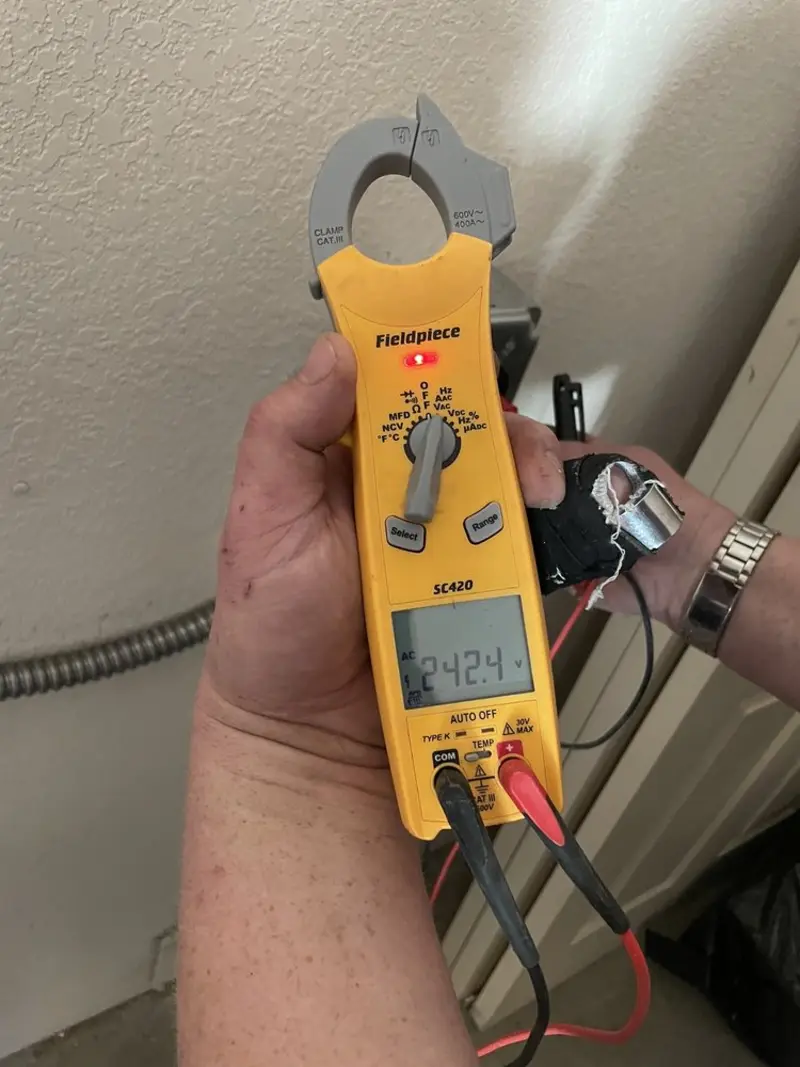 Voltage testing with clamp meter during Outlet Installation in Mechanicville